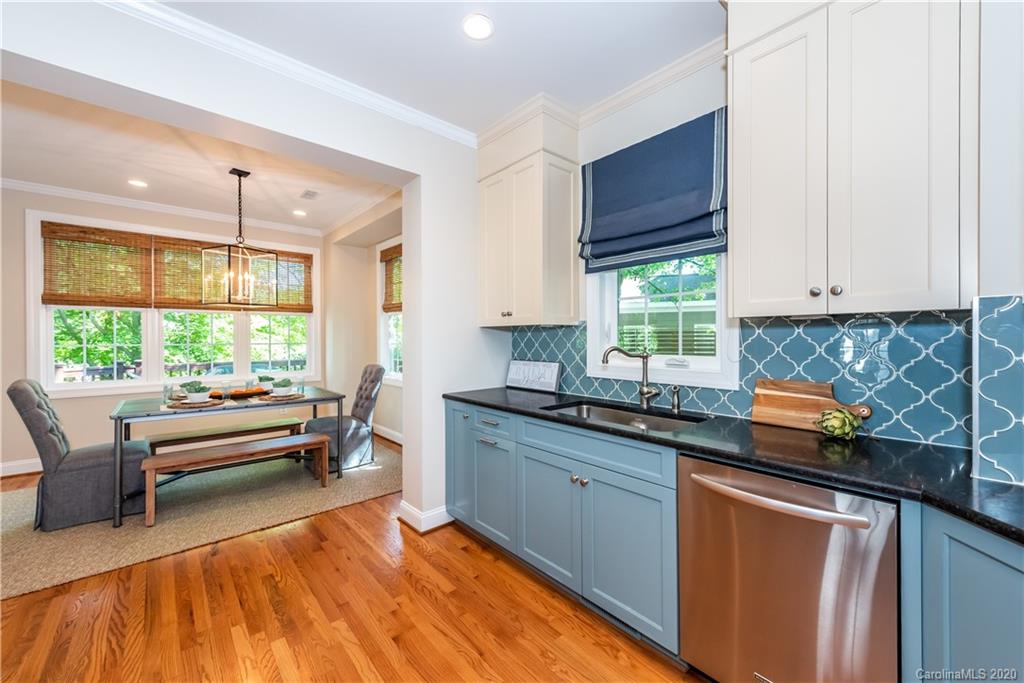 1315 Lilac Road Charlotte, NC 28209 - Photo 11 of 48 a kitchen with stainless steel appliances granite countertop a sink stove and cabinets