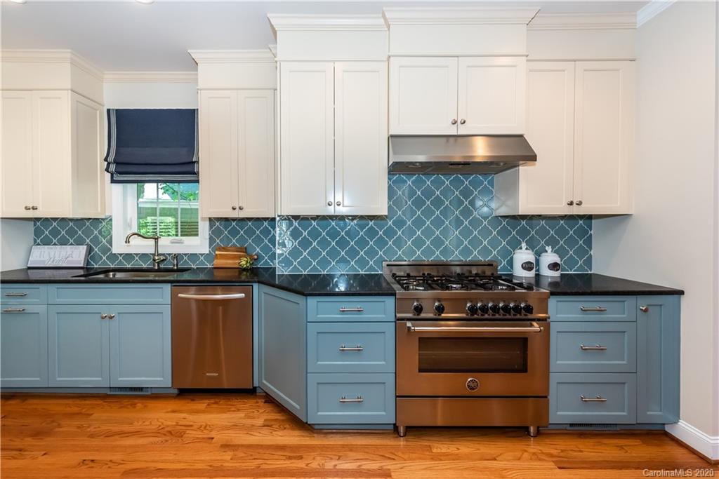 1315 Lilac Road Charlotte, NC 28209 - Photo 13 of 48 a kitchen with granite countertop a stove and a sink