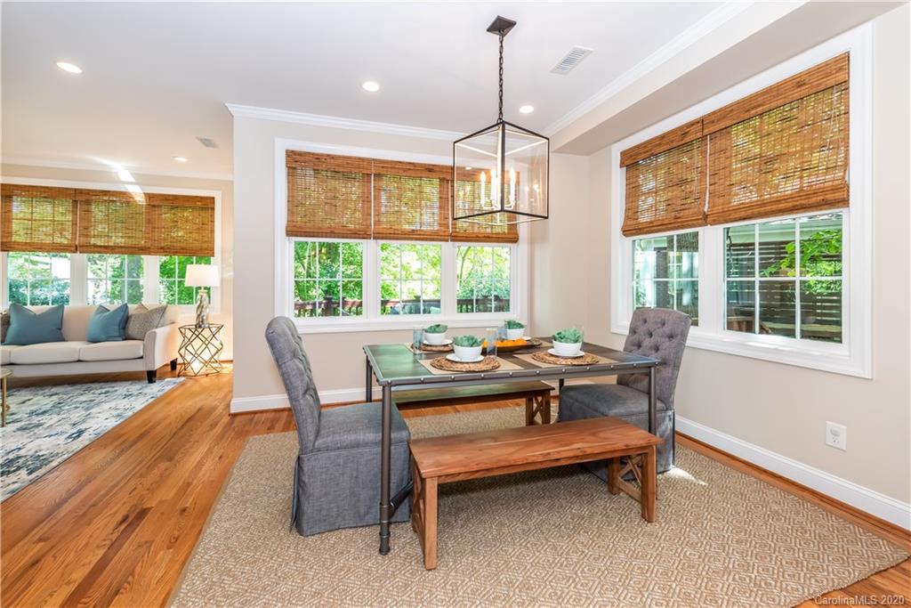 1315 Lilac Road Charlotte, NC 28209 - Photo 14 of 48 a dining room with wooden floor wooden floor and a rug