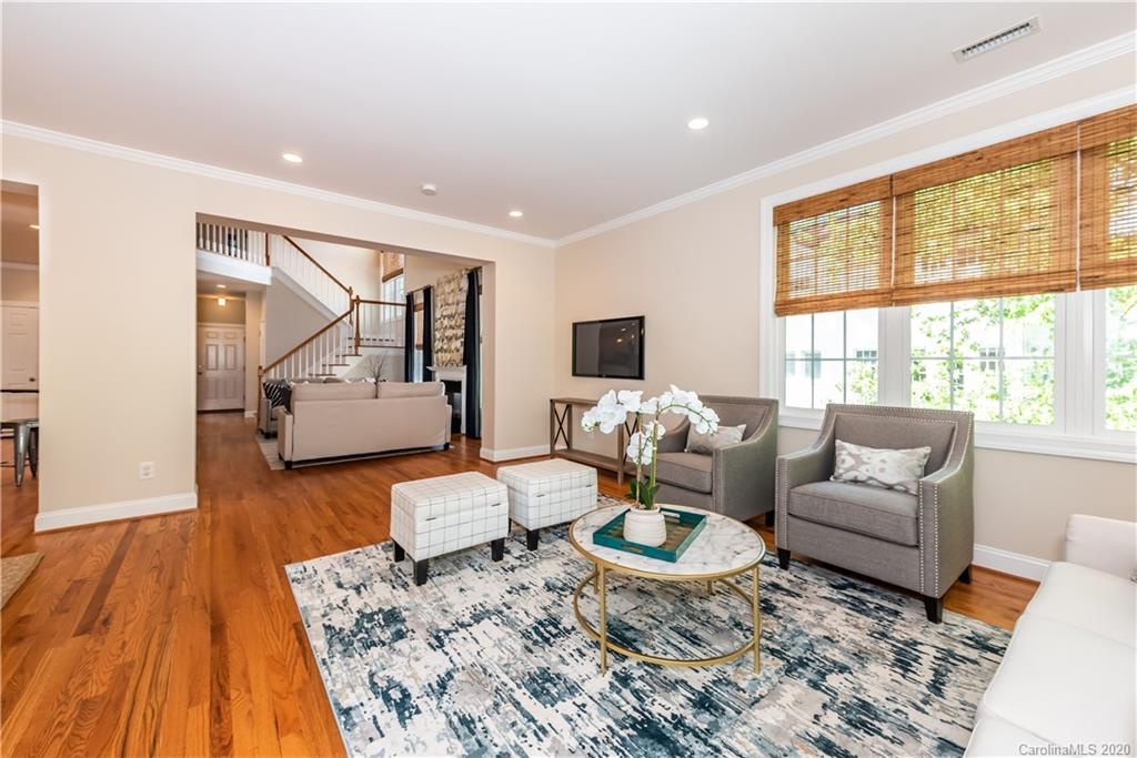 1315 Lilac Road Charlotte, NC 28209 - Photo 16 of 48 a living room with furniture and a wooden floor