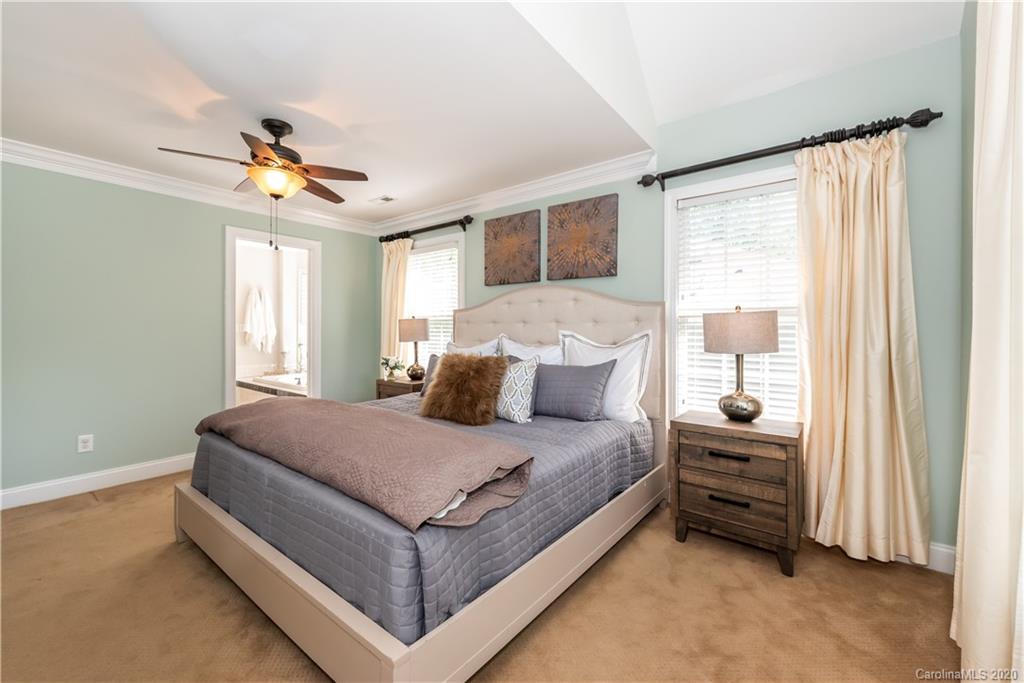 1315 Lilac Road Charlotte, NC 28209 - Photo 20 of 48 a bedroom with a bed next to a window