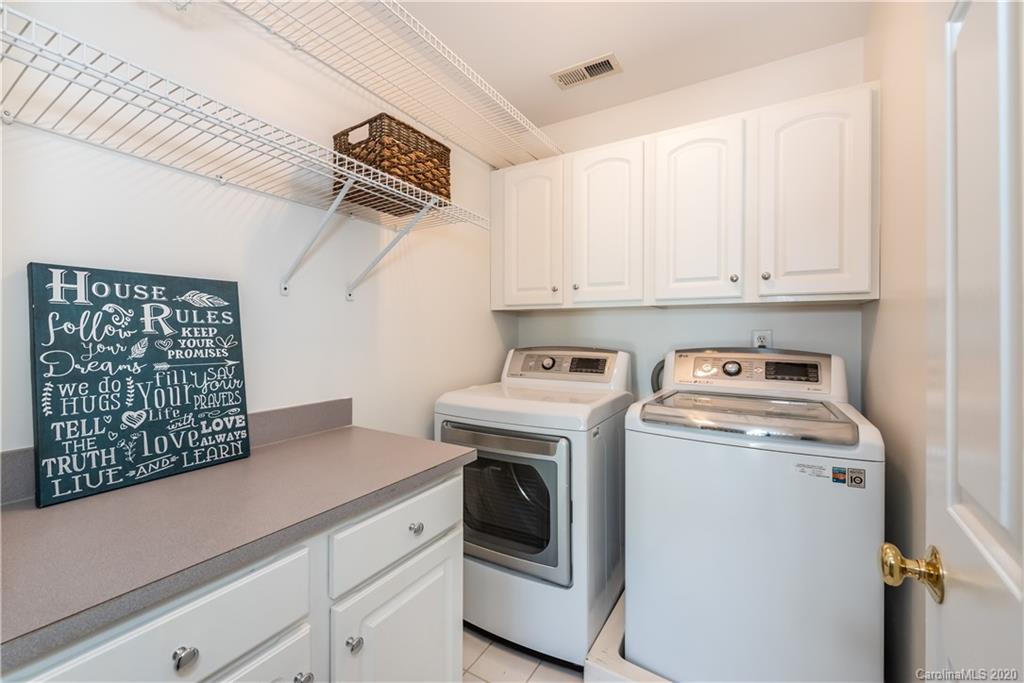 1315 Lilac Road Charlotte, NC 28209 - Photo 25 of 48 a utility room with dryer and washer