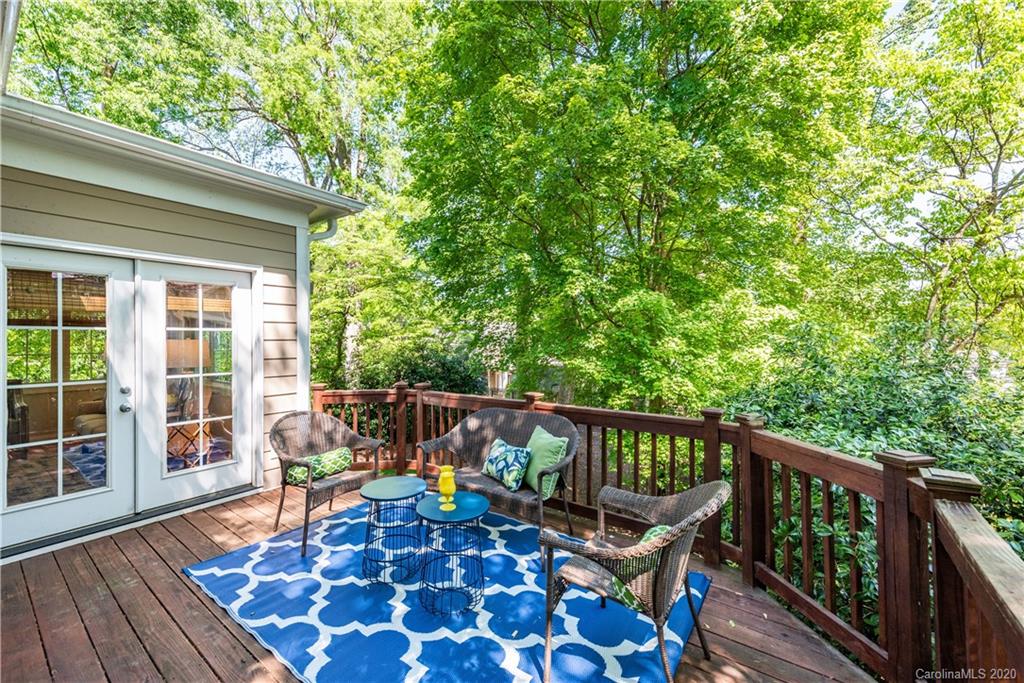 1315 Lilac Road Charlotte, NC 28209 - Photo 29 of 48 a balcony with wooden floor and furniture