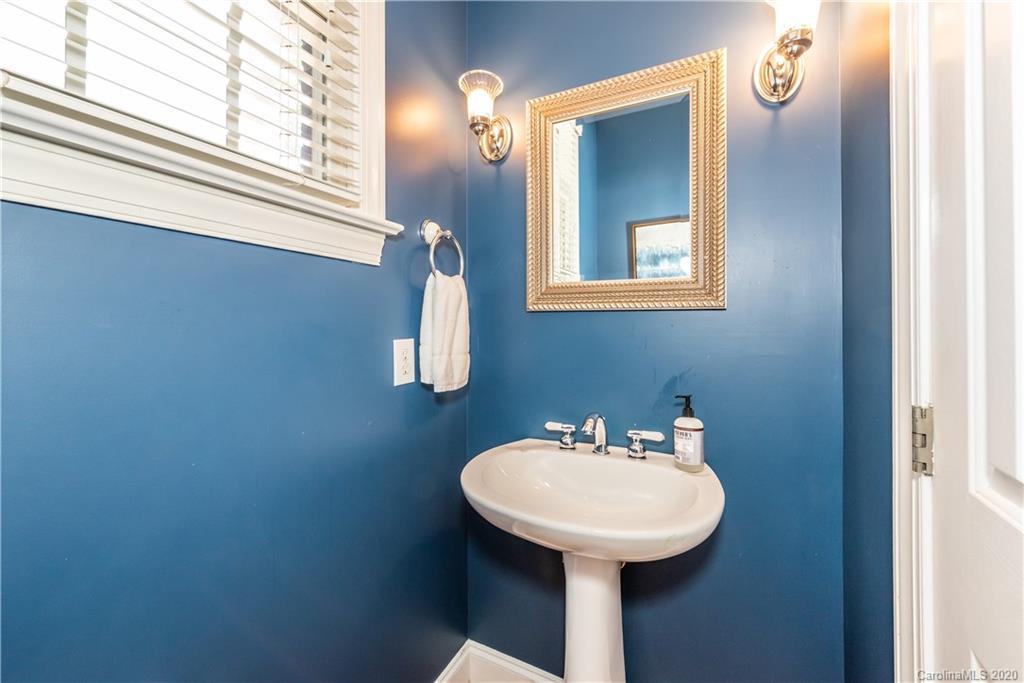 1315 Lilac Road Charlotte, NC 28209 - Photo 4 of 48 a bathroom with a sink and a mirror