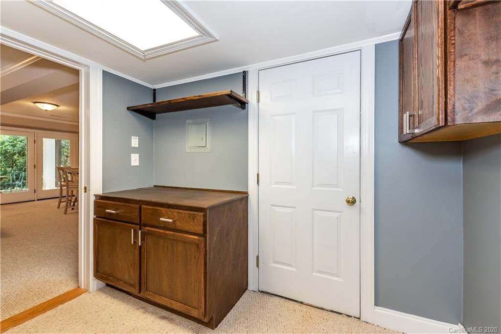 1315 Lilac Road Charlotte, NC 28209 - Photo 34 of 48 a kitchen with a stove and a cabinet