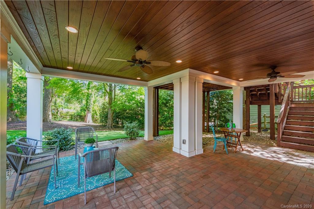 1315 Lilac Road Charlotte, NC 28209 - Photo 40 of 48 a view of a porch with furniture and floor