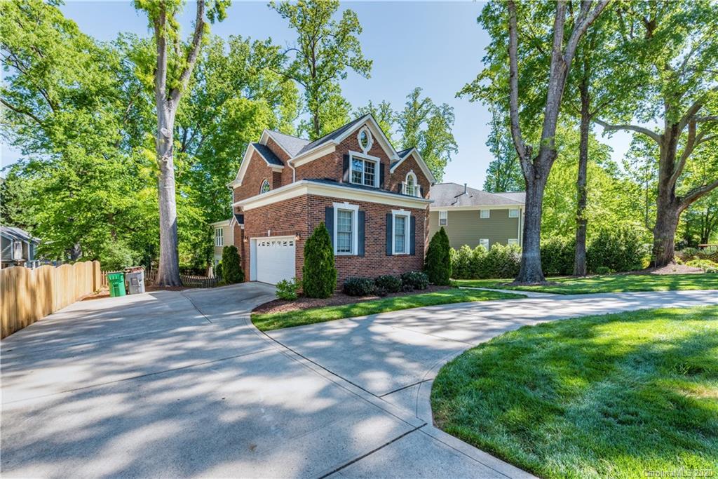 1315 Lilac Road Charlotte, NC 28209 - Photo 47 of 48 a front view of a house with a yard and trees