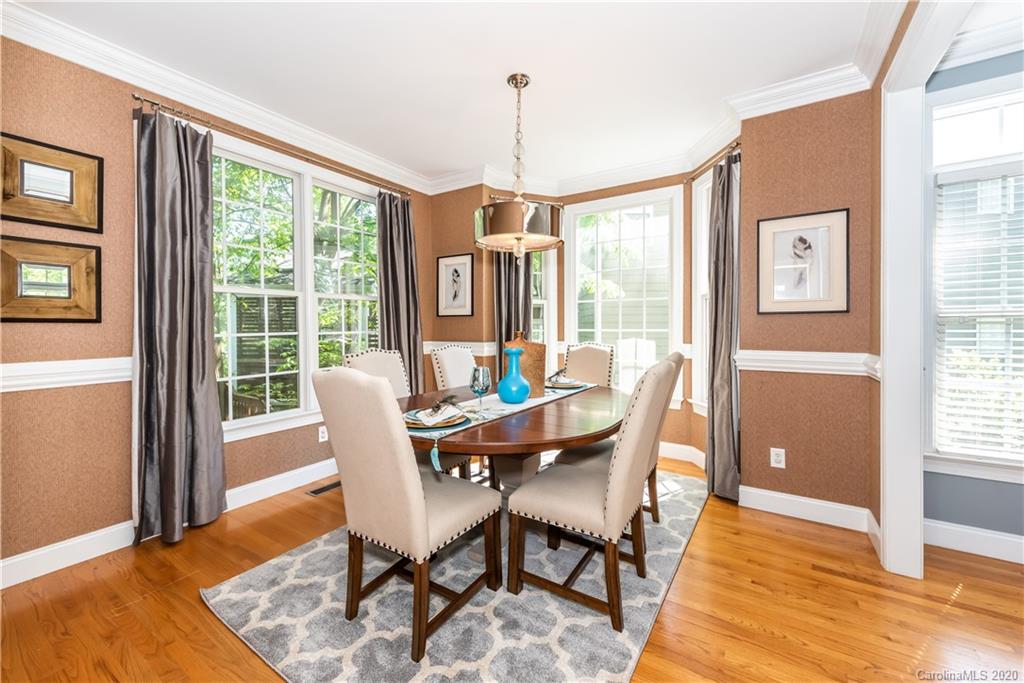 1315 Lilac Road Charlotte, NC 28209 - Photo 8 of 48 a dining room with furniture window wooden floor