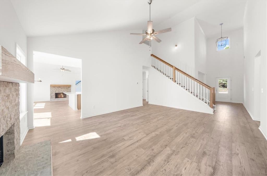 8905 Bethel Road Gainesville, GA 30506 - Photo 15 of 72 a view of a livingroom with wooden floor and staircase