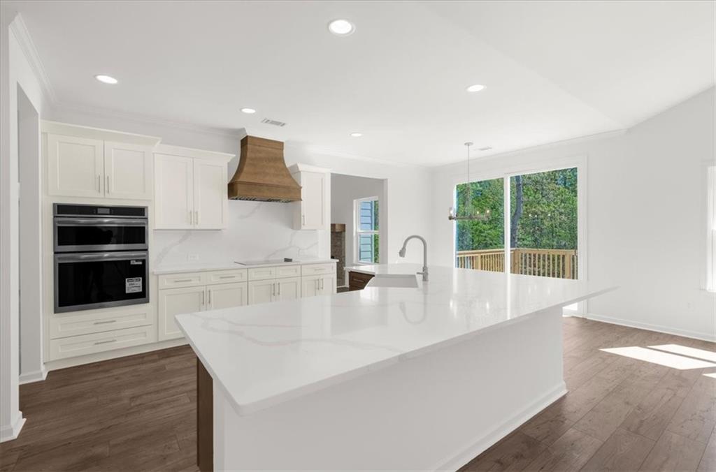 8905 Bethel Road Gainesville, GA 30506 - Photo 25 of 72 a kitchen with stainless steel appliances a sink and a large window