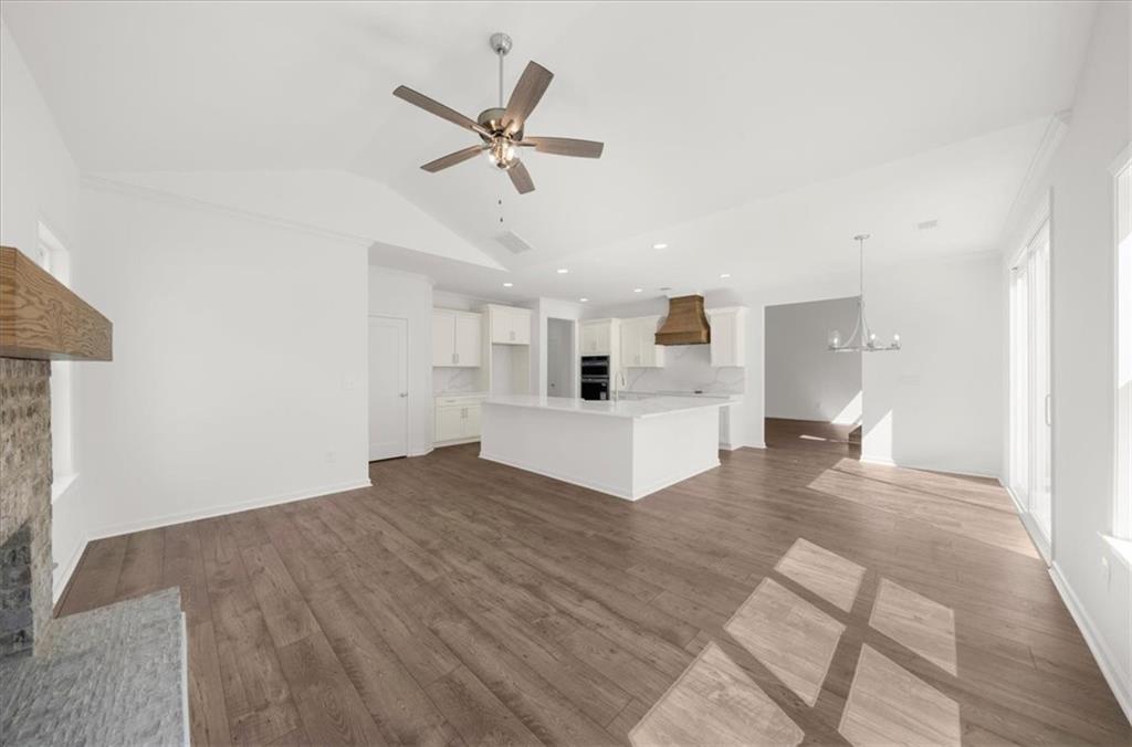 8905 Bethel Road Gainesville, GA 30506 - Photo 27 of 72 a view of a big room with wooden floor and windows