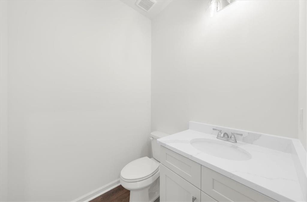 8905 Bethel Road Gainesville, GA 30506 - Photo 36 of 72 a bathroom with a sink and a toilet