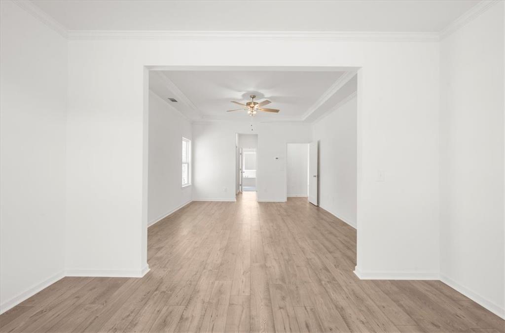 8905 Bethel Road Gainesville, GA 30506 - Photo 38 of 72 a view of a room with wooden floor and a ceiling fan