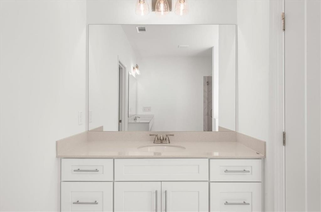 8905 Bethel Road Gainesville, GA 30506 - Photo 45 of 72 a bathroom with a sink and a mirror