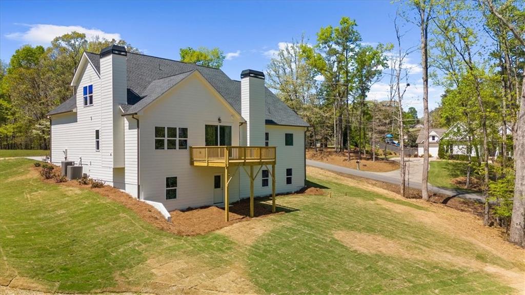 8905 Bethel Road Gainesville, GA 30506 - Photo 61 of 72 a view of a house with a yard