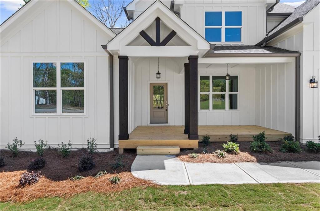 8905 Bethel Road Gainesville, GA 30506 - Photo 8 of 72 a front view of a house with garden