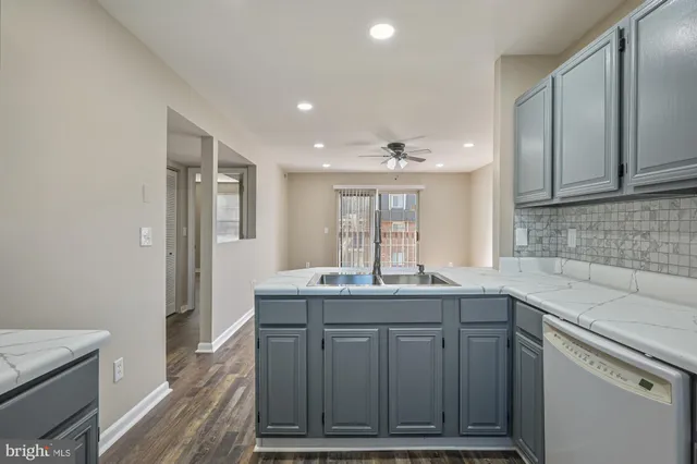 a kitchen with a sink and cabinets