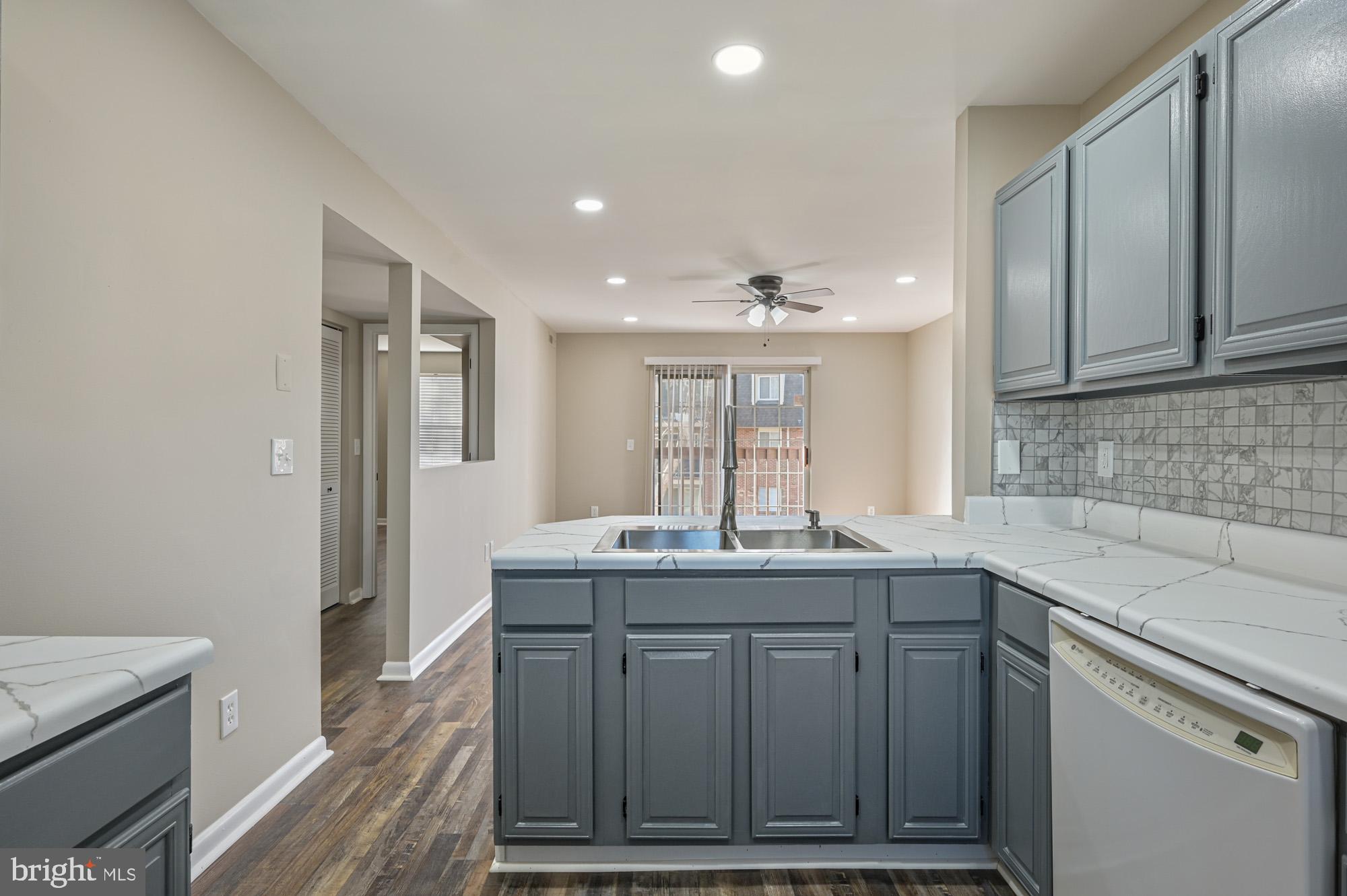 102 North Caroline Place, Unit 203 Dover, DE 19904 - Photo 6 of 12 a kitchen with a sink and cabinets