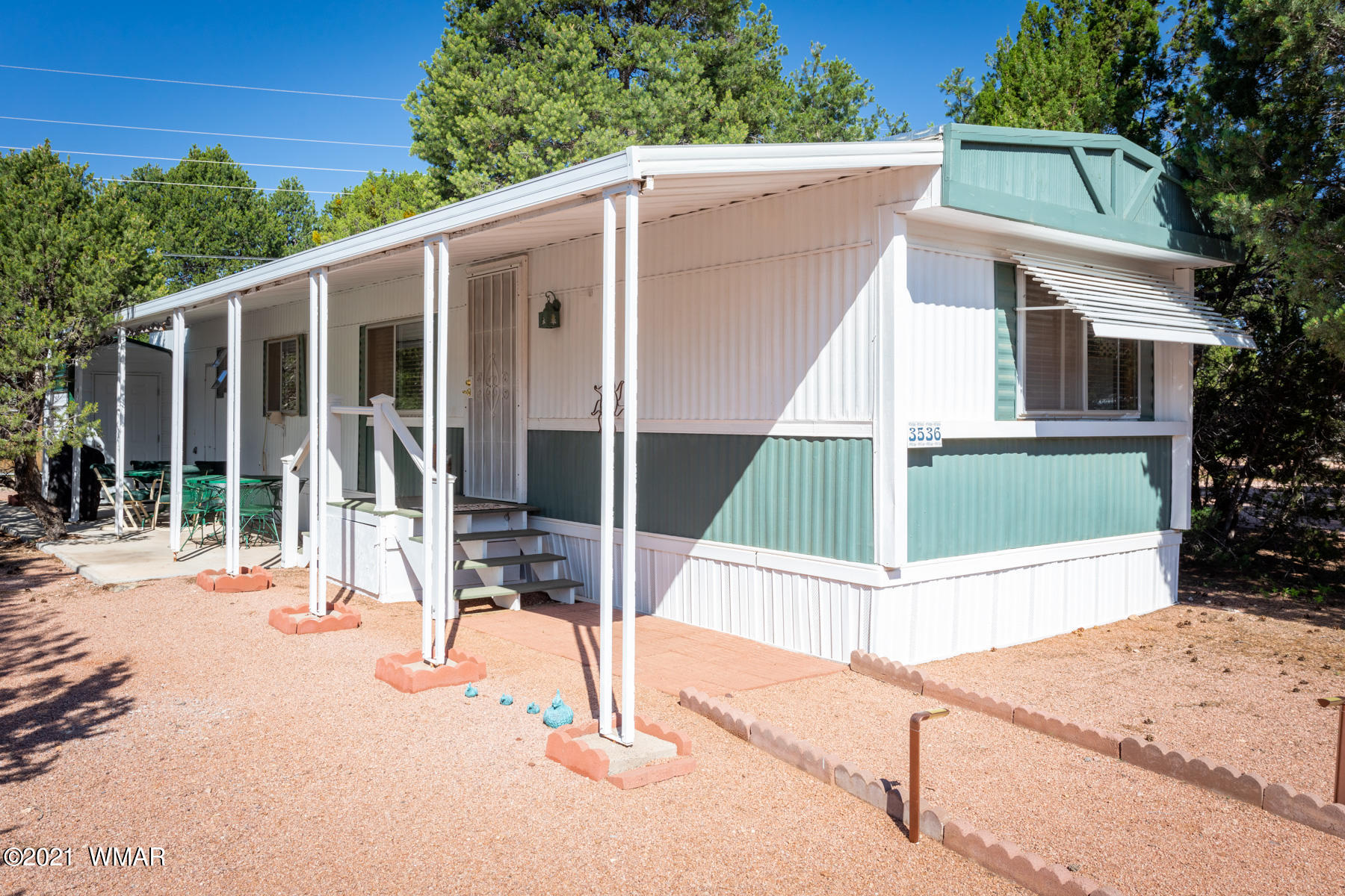 3536 Quail Run Road Overgaard, AZ 85933 - Photo 1 of 26 a view of a house with backyard and porch