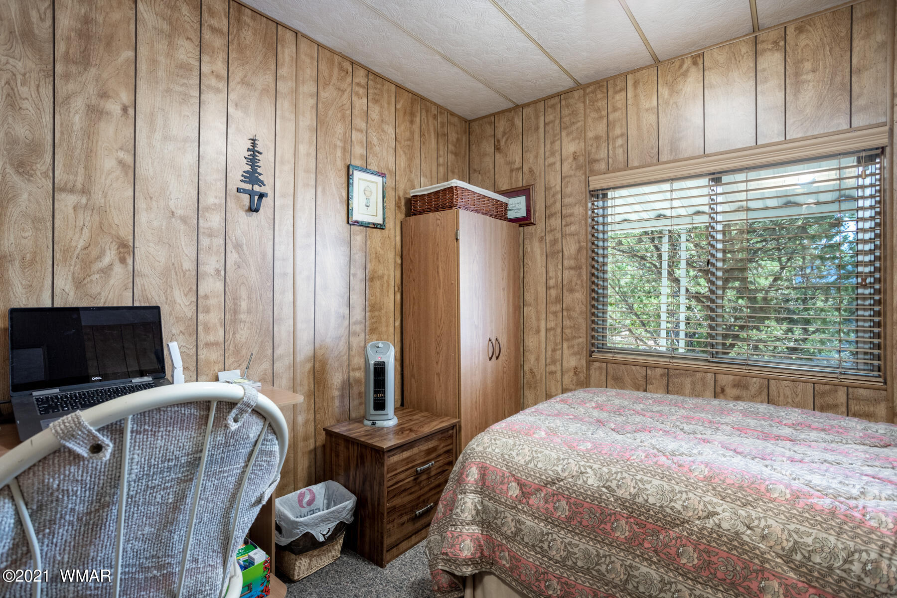 3536 Quail Run Road Overgaard, AZ 85933 - Photo 11 of 26 a bedroom with a bed flat screen tv and a large window