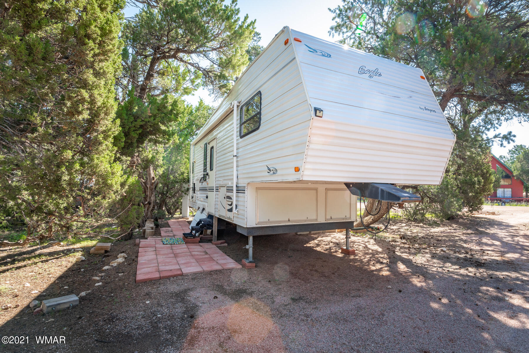 3536 Quail Run Road Overgaard, AZ 85933 - Photo 14 of 26 a white house covered with tall trees