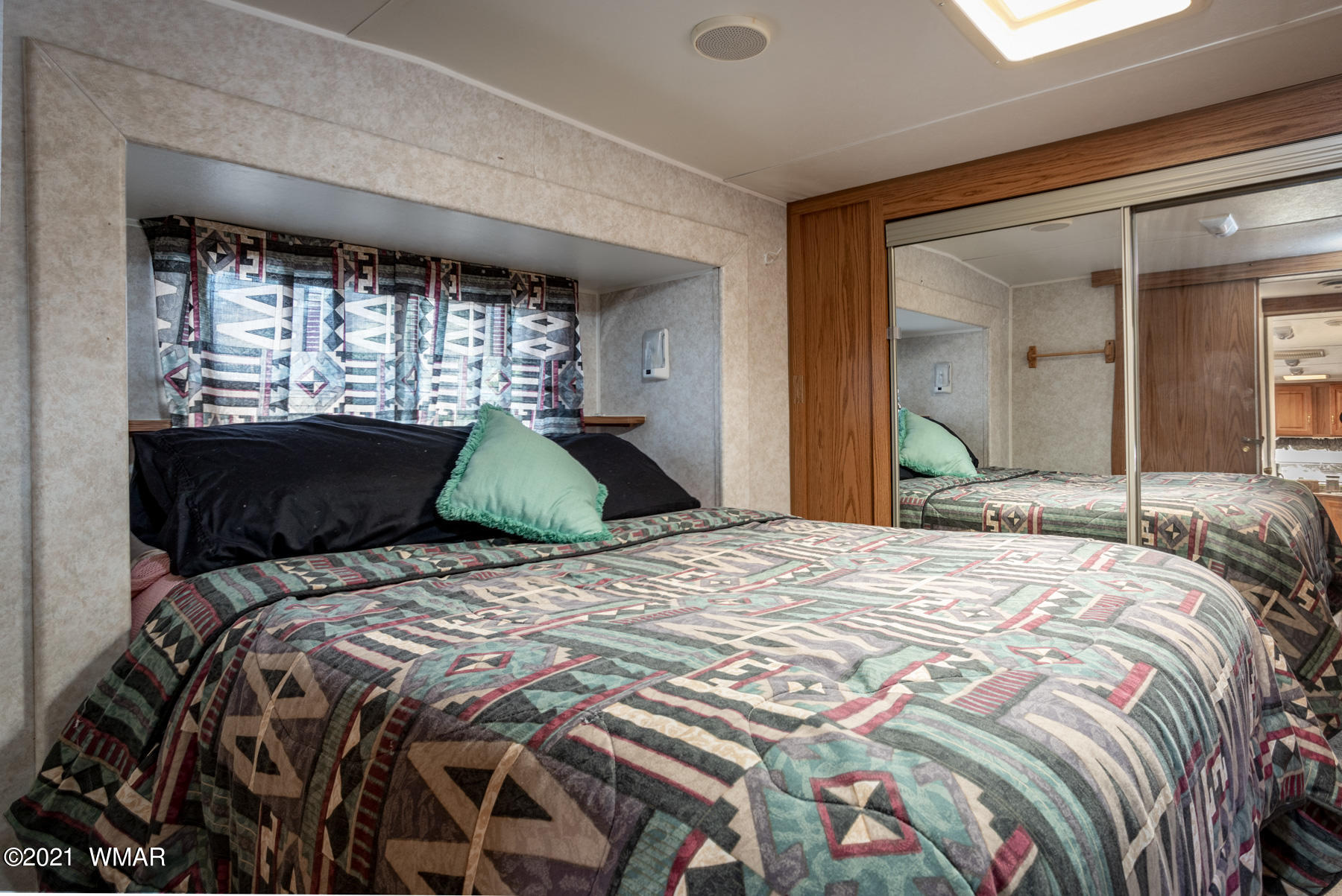 3536 Quail Run Road Overgaard, AZ 85933 - Photo 18 of 26 a bedroom with a bed and window