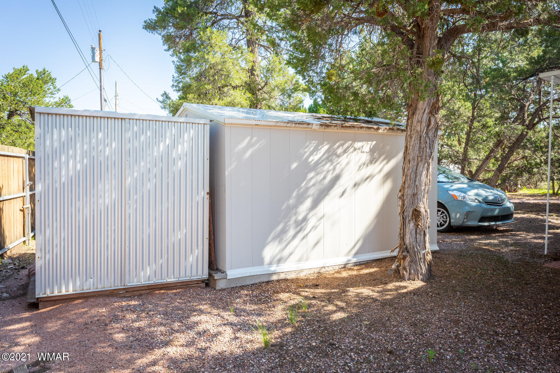 3536 Quail Run Road Overgaard, AZ 85933 - Photo 24 of 26 a view of a house with a tree in the background