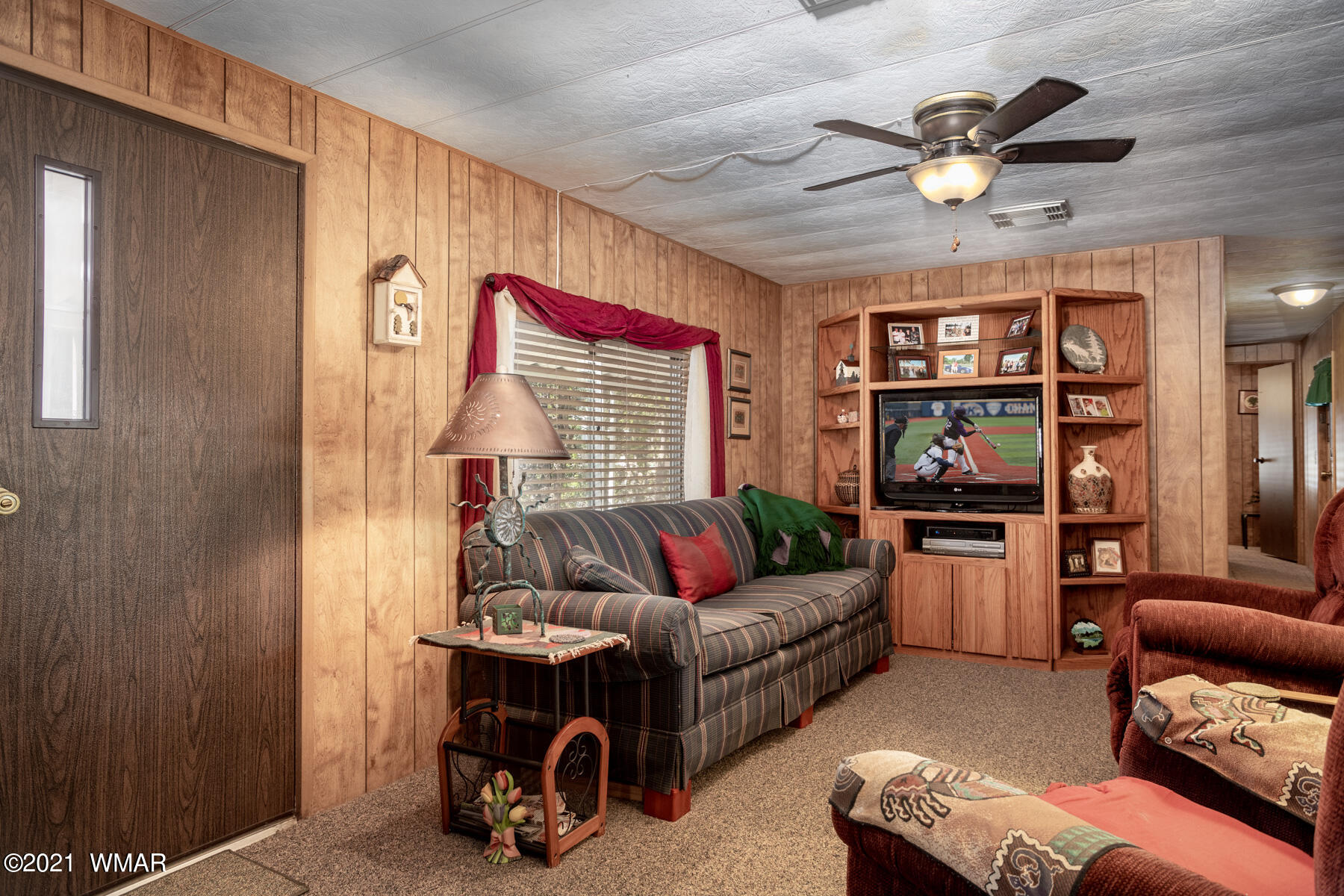3536 Quail Run Road Overgaard, AZ 85933 - Photo 6 of 26 a living room with furniture and a window