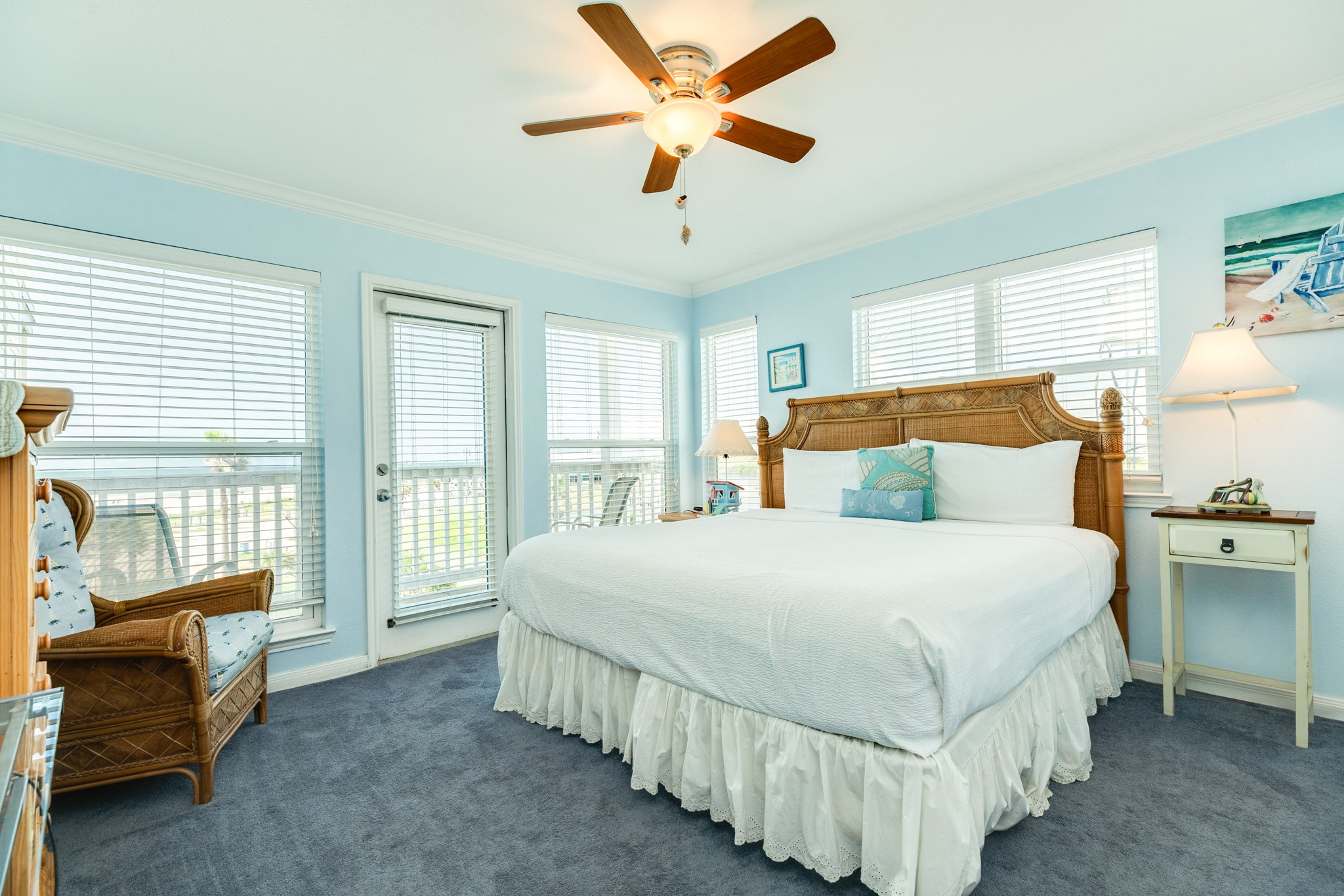 10811 Termini-San Luis Pass Road, Unit 1201 Galveston, TX 77554 - Photo 15 of 25 a bedroom with a bed and a chandelier fan