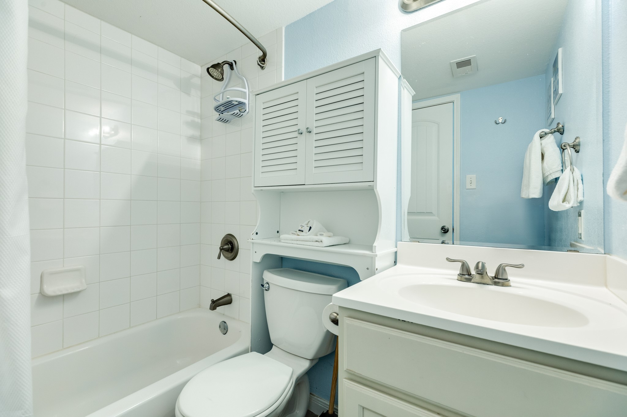 10811 Termini-San Luis Pass Road, Unit 1201 Galveston, TX 77554 - Photo 17 of 25 a bathroom with a sink toilet and shower