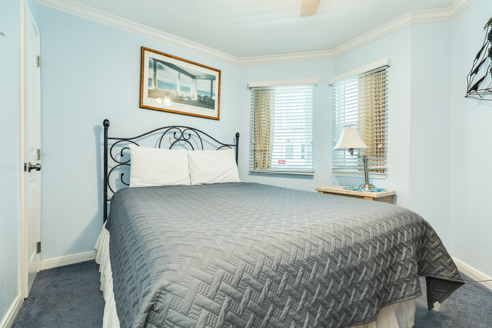 10811 Termini-San Luis Pass Road, Unit 1201 Galveston, TX 77554 - Photo 18 of 25 a bedroom with a bed and a window