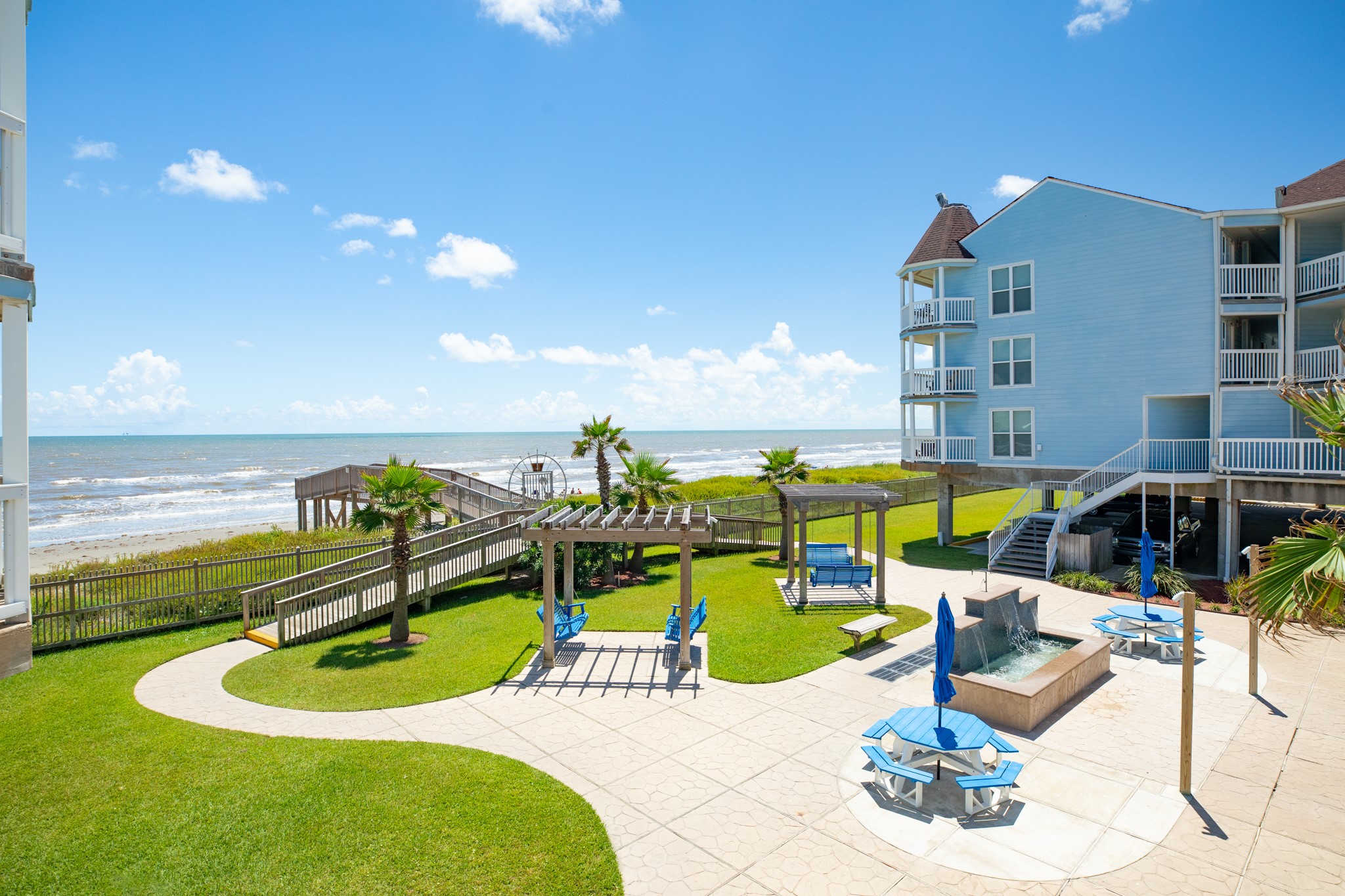 10811 Termini-San Luis Pass Road, Unit 1201 Galveston, TX 77554 - Photo 24 of 25 a view of a swimming pool with a lounge chair