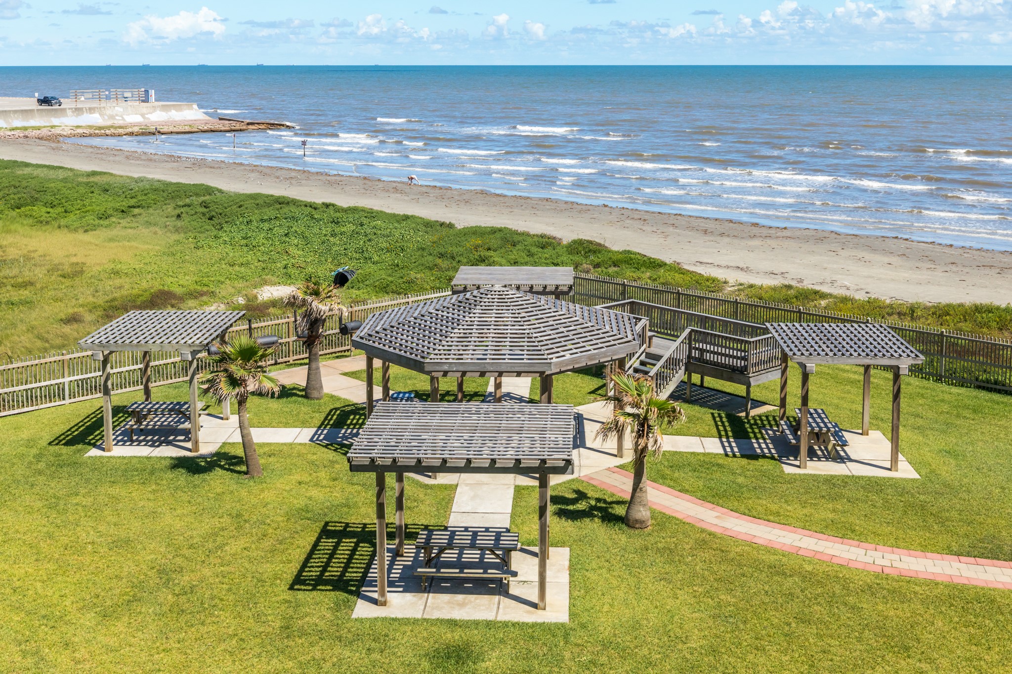 10811 Termini-San Luis Pass Road, Unit 1201 Galveston, TX 77554 - Photo 25 of 25 a view of a swimming pool with lawn chairs