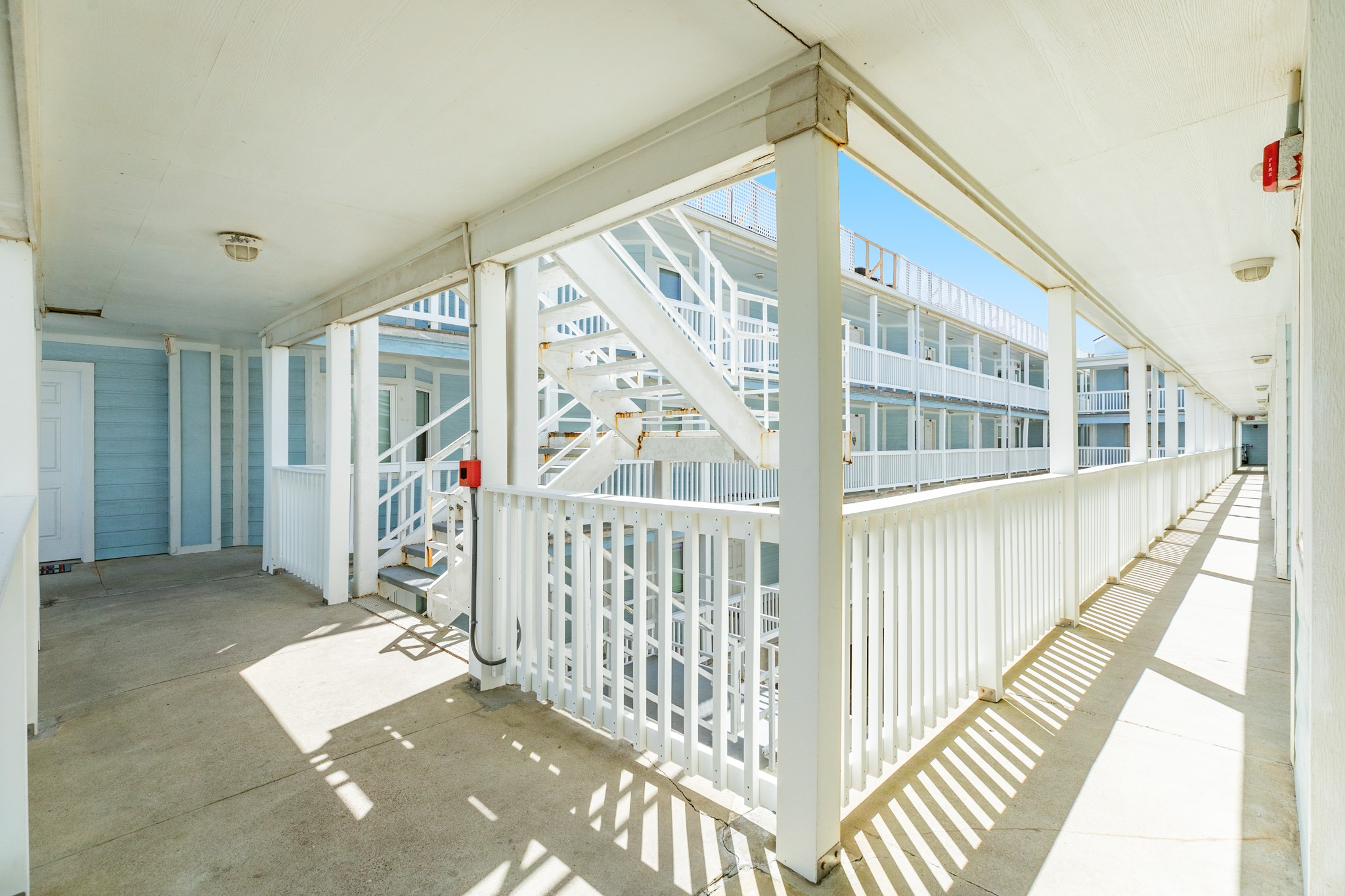 10811 Termini-San Luis Pass Road, Unit 1201 Galveston, TX 77554 - Photo 3 of 25 a view of entryway with wooden floor and windows