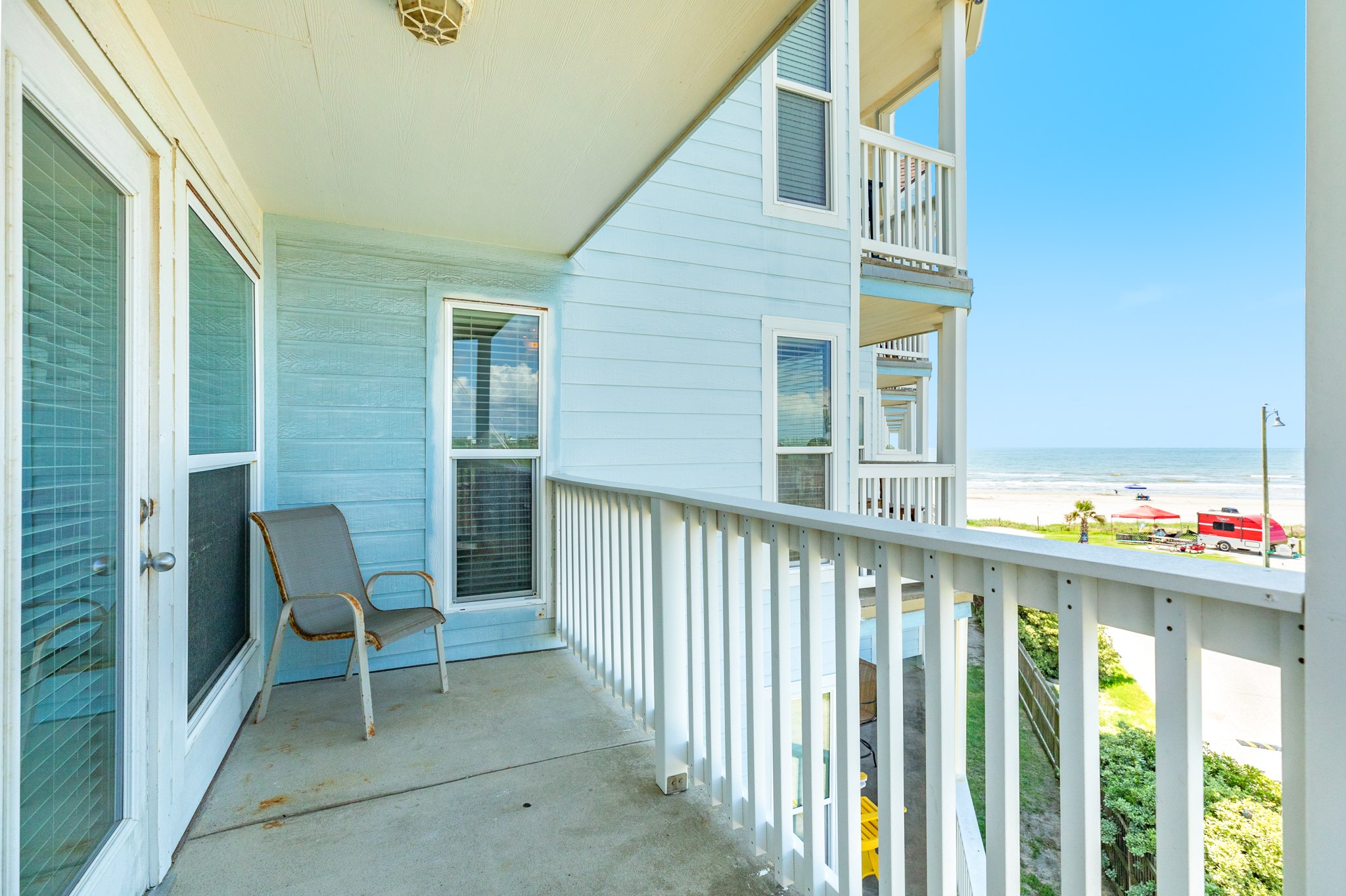 10811 Termini-San Luis Pass Road, Unit 1201 Galveston, TX 77554 - Photo 5 of 25 a view of a chair and fire pit in front of house