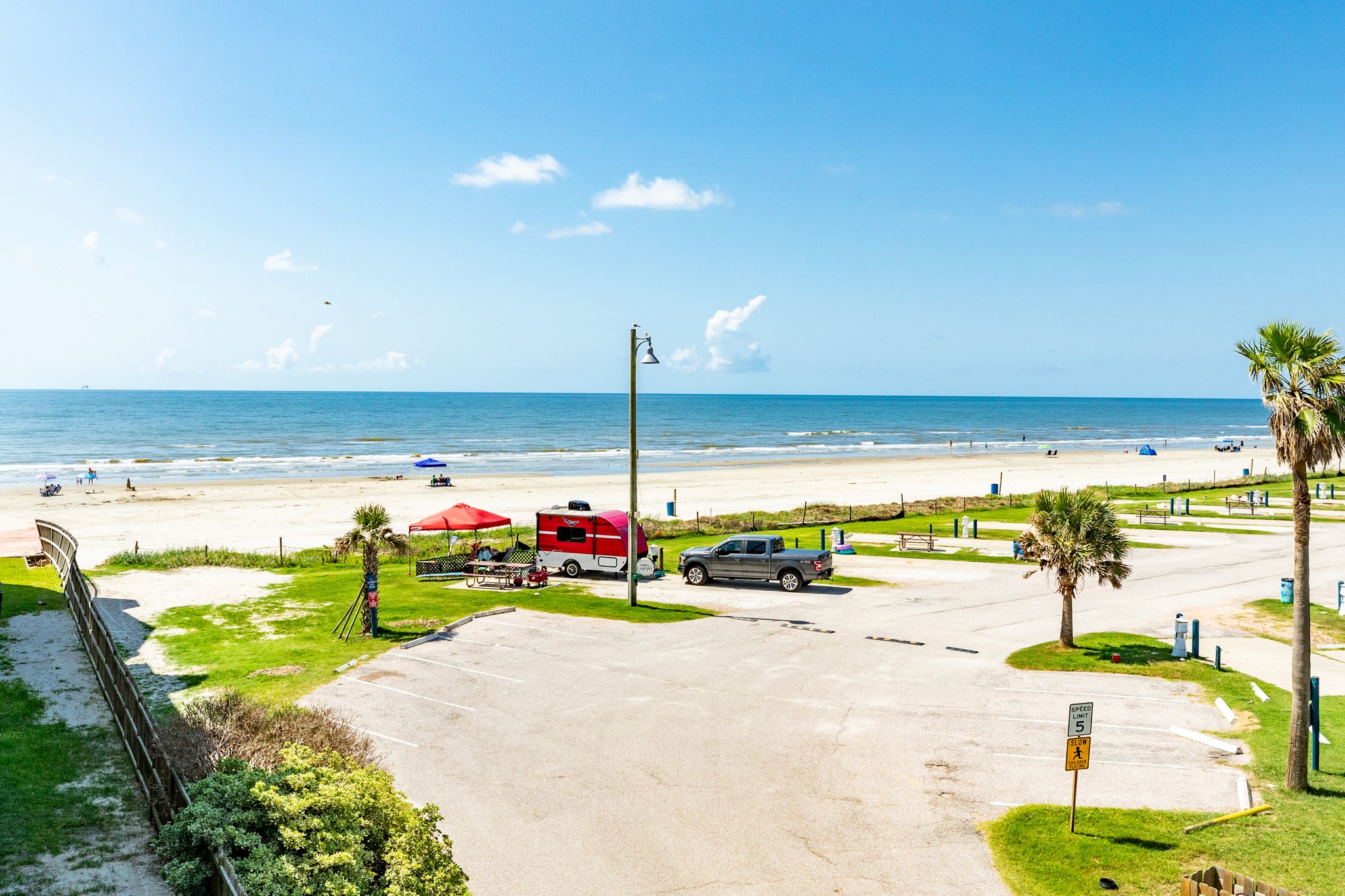 10811 Termini-San Luis Pass Road, Unit 1201 Galveston, TX 77554 - Photo 6 of 25 a view of a swimming pool with an outdoor seating