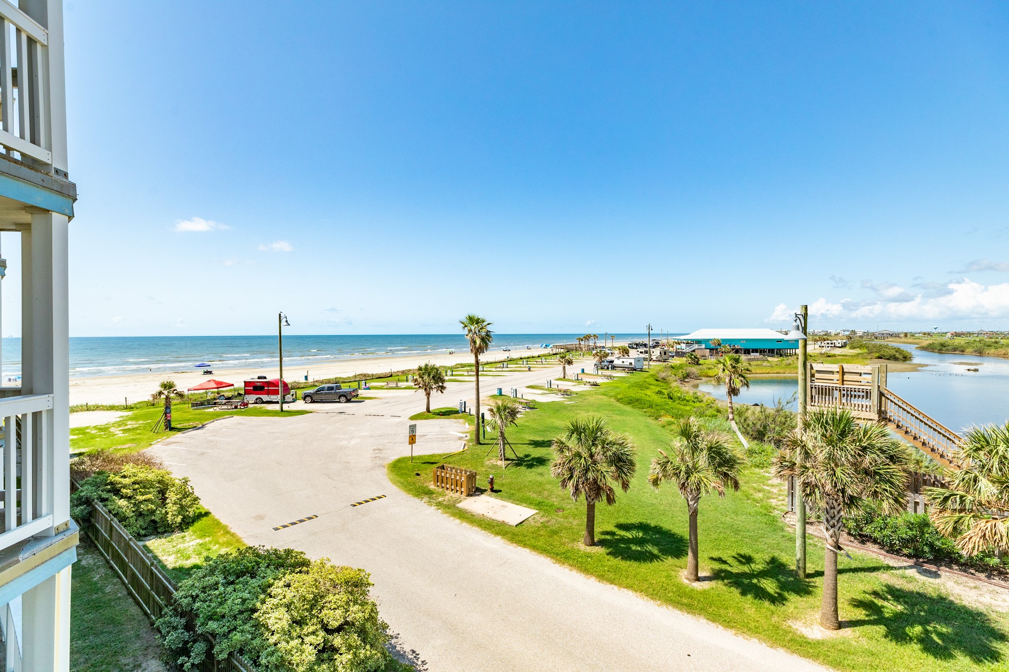 10811 Termini-San Luis Pass Road, Unit 1201 Galveston, TX 77554 - Photo 7 of 25 a view of a swimming pool and an outdoor seating