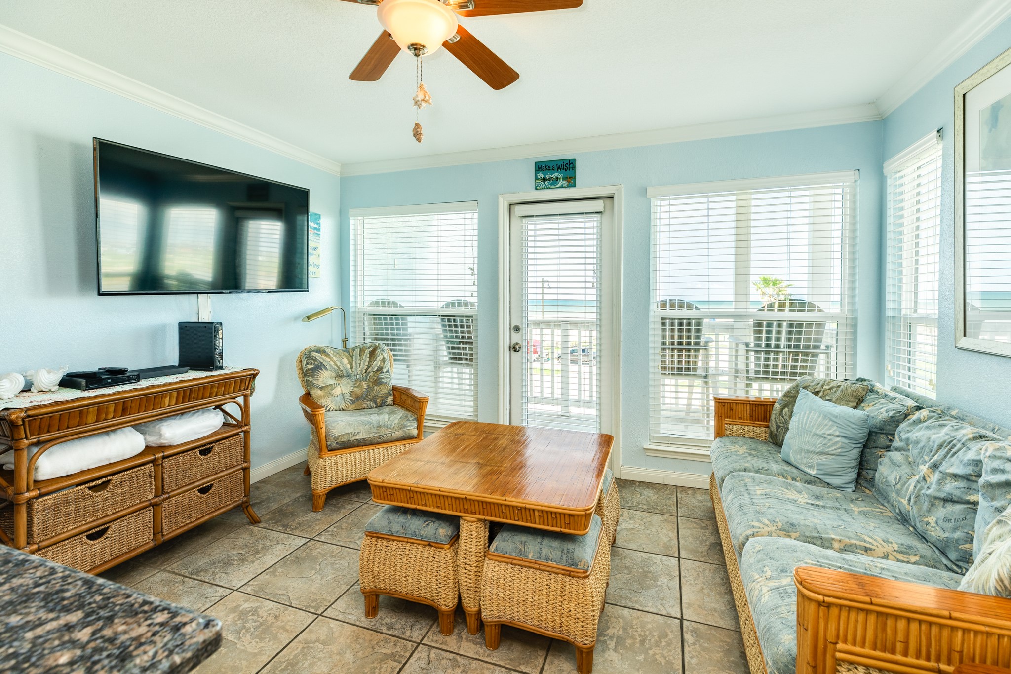 10811 Termini-San Luis Pass Road, Unit 1201 Galveston, TX 77554 - Photo 9 of 25 a living room with furniture and windows