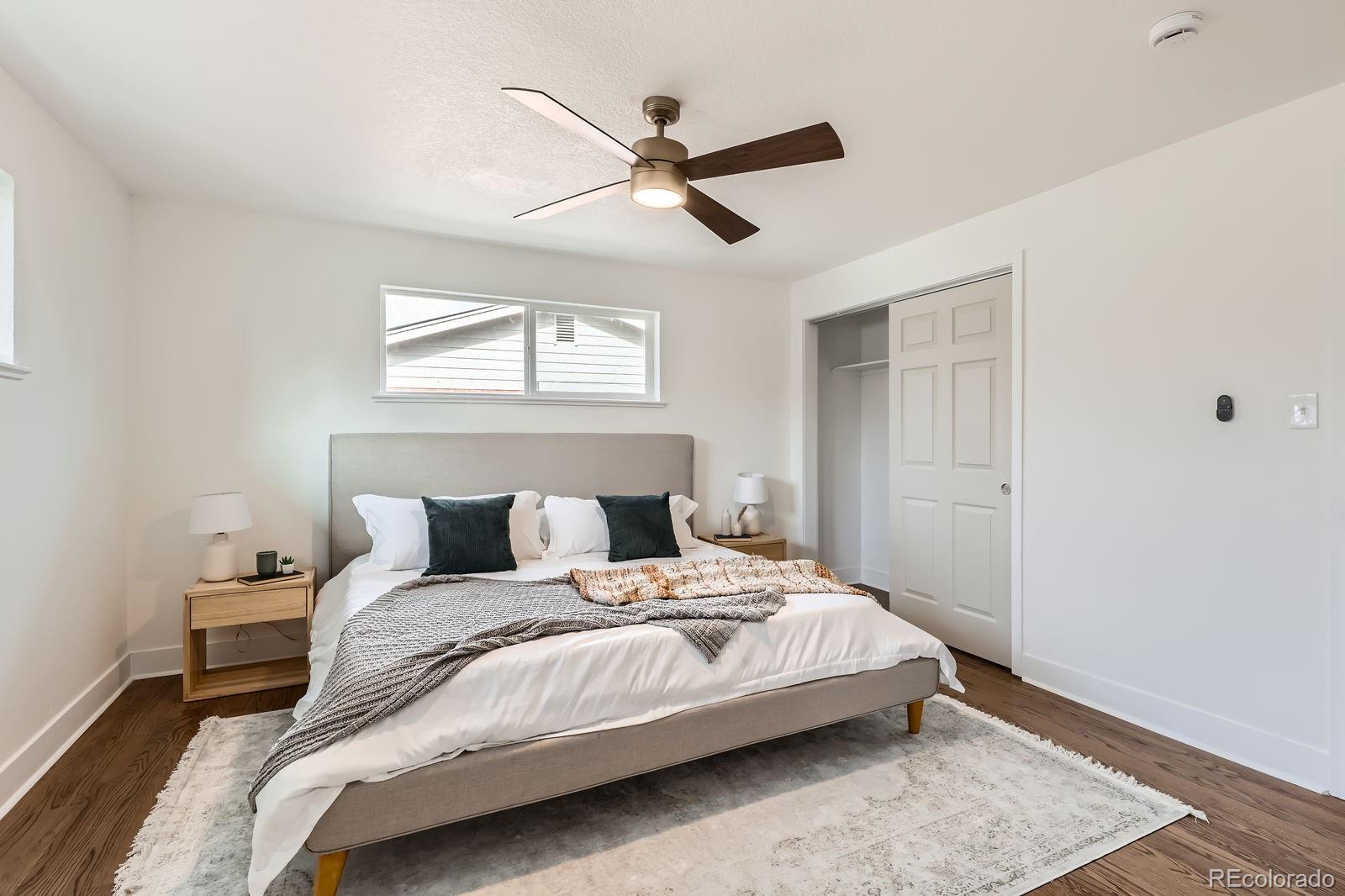 9455 West 37th Avenue Wheat Ridge, CO 80033 - Photo 14 of 33 a bedroom with a bed and window
