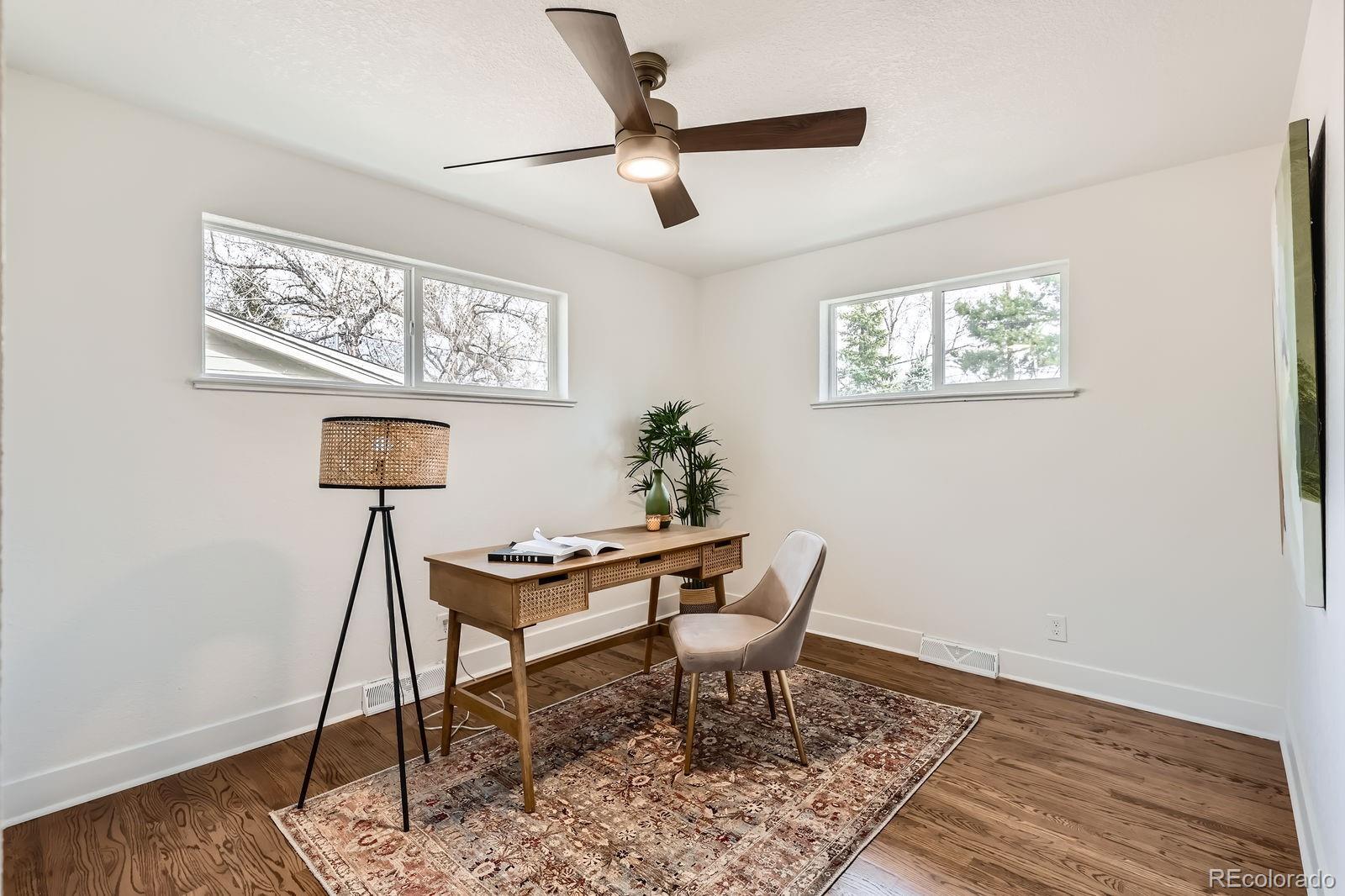 9455 West 37th Avenue Wheat Ridge, CO 80033 - Photo 19 of 33 a work room with furniture and a window