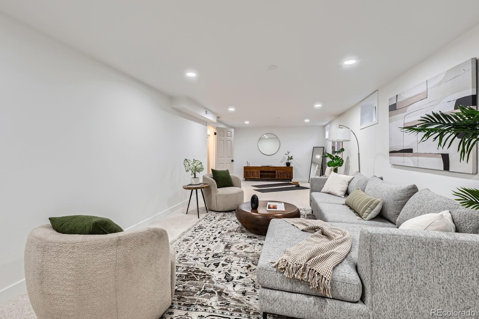 9455 West 37th Avenue Wheat Ridge, CO 80033 - Photo 21 of 33 a living room with furniture a couch and a potted plant