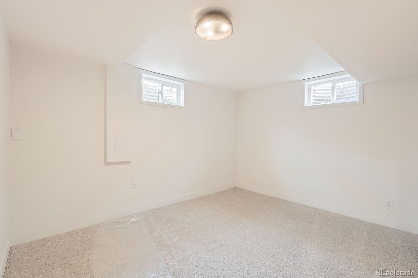 9455 West 37th Avenue Wheat Ridge, CO 80033 - Photo 25 of 33 an empty room with windows