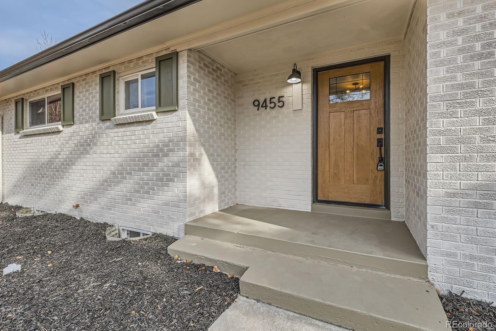 9455 West 37th Avenue Wheat Ridge, CO 80033 - Photo 3 of 33 a view of a car garage door