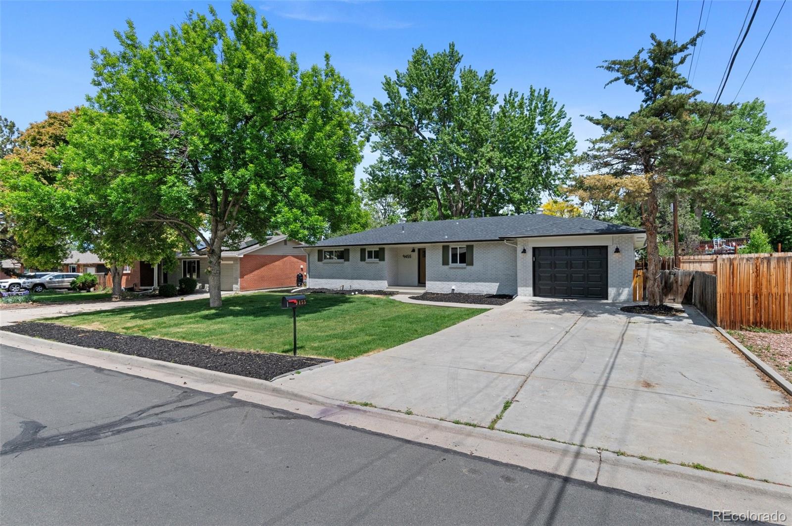 9455 West 37th Avenue Wheat Ridge, CO 80033 - Photo 32 of 33 front view of a house with a yard