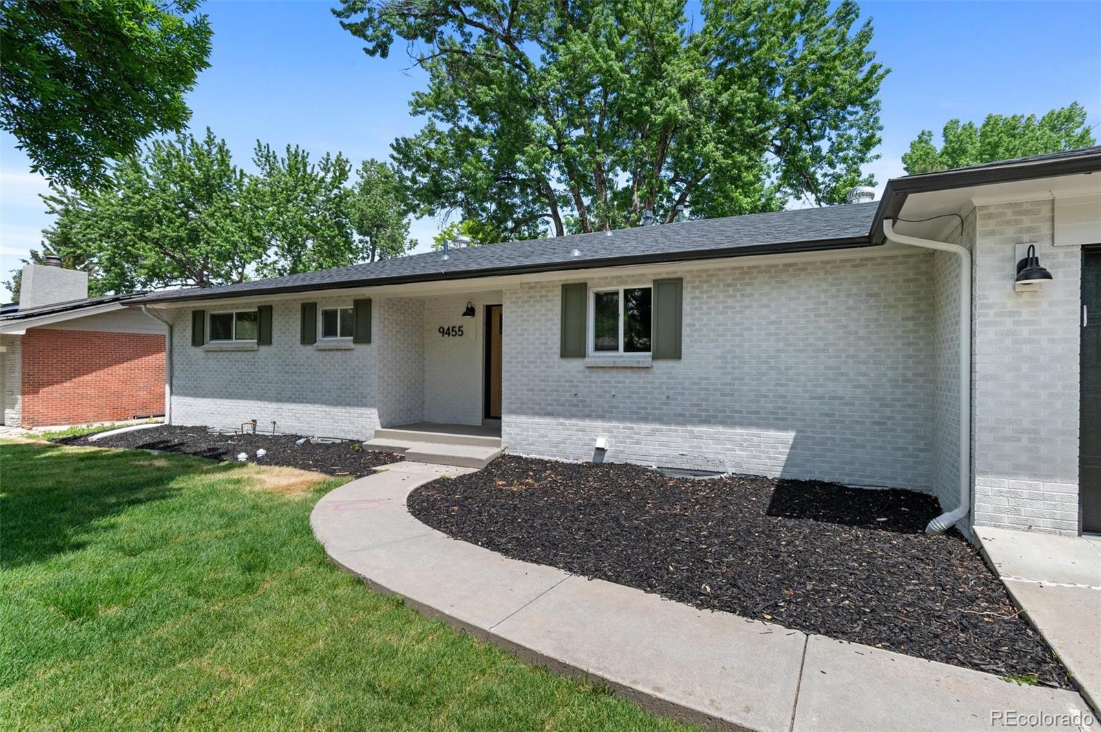 9455 West 37th Avenue Wheat Ridge, CO 80033 - Photo 33 of 33 a view of a house with a yard