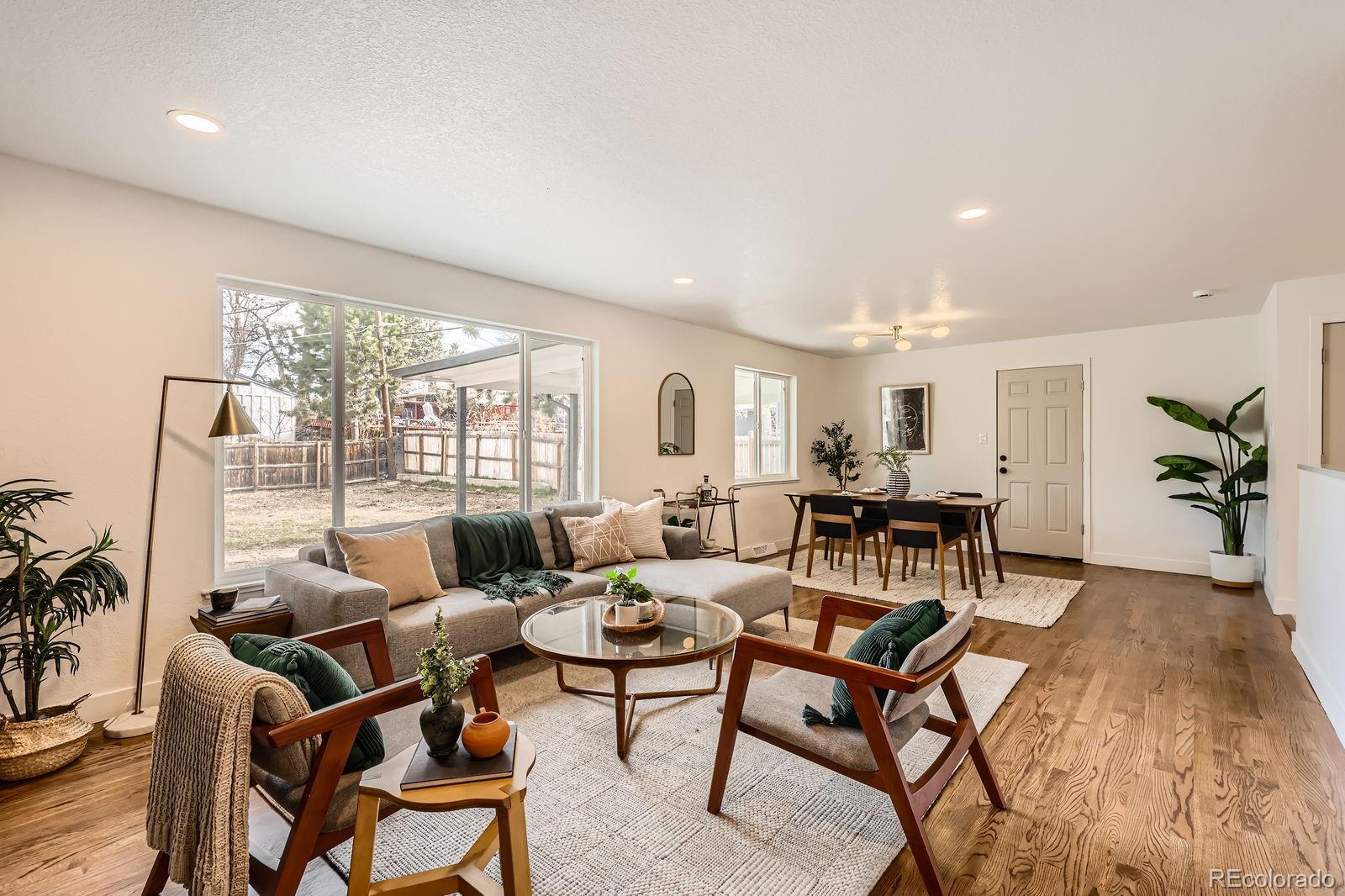 9455 West 37th Avenue Wheat Ridge, CO 80033 - Photo 5 of 33 a living room with furniture and a large window