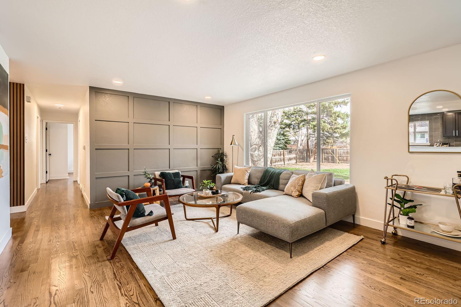 9455 West 37th Avenue Wheat Ridge, CO 80033 - Photo 6 of 33 a living room with furniture and a large window