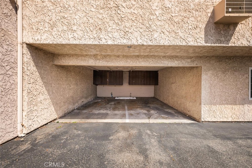 7890 East Spring Street, Unit 15D Long Beach, CA 90815 - Photo 29 of 40 Assigned carport on the right