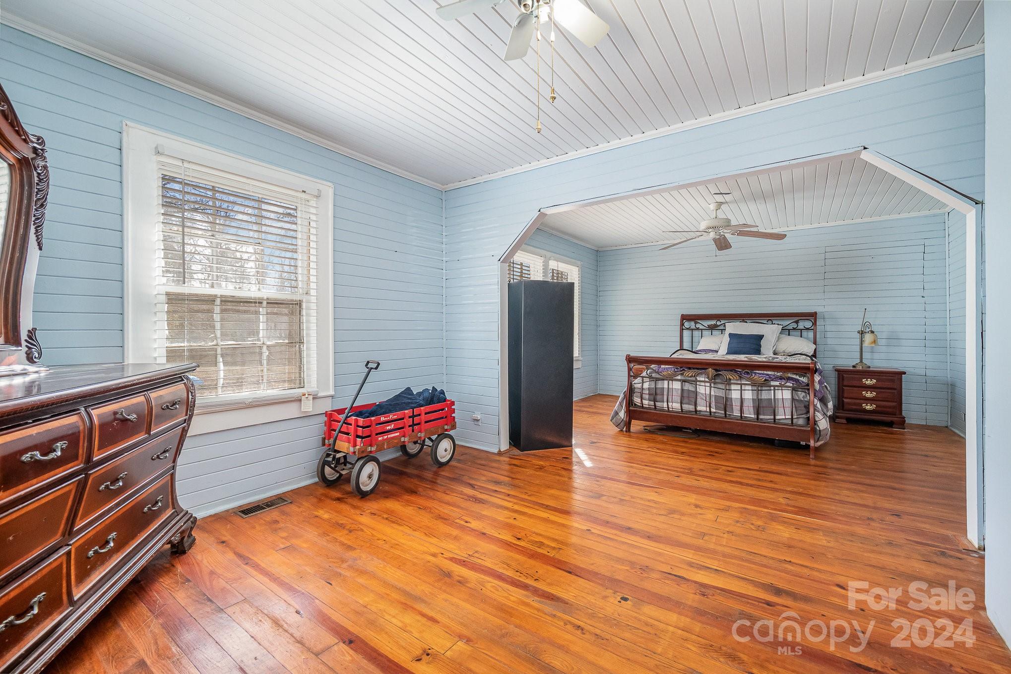 3704 State Rd S-29-315 Lancaster, SC 29720 - Photo 19 of 30 a bedroom with furniture and a large window