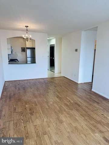 a kitchen with granite countertop white cabinets and sink